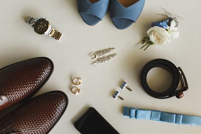 Men's and women's wedding accessories on the table