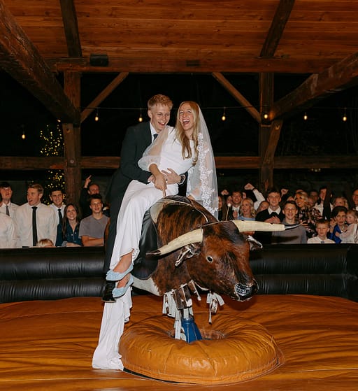 Buck Wild 21 - Bay + Bre Photo - Mechanical Bull Riding Rental Wedding Vendor Buck Wild Bride and Groom - Bay + Bre Photo - Mechanical Bull Riding Rental Wedding Vendor
