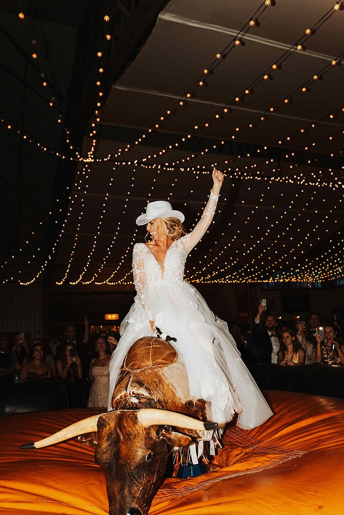 Bride on Buck Wild Bull - Sarah Penny Photography - Mechanical Bull Riding Rental Wedding Vendor Bride