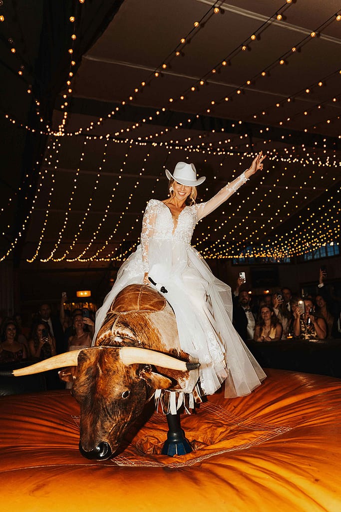 Buck Wild Bride on Bull - Sarah Penny Photography - Mechanical Bull Riding Rental Bride Wedding Vendor