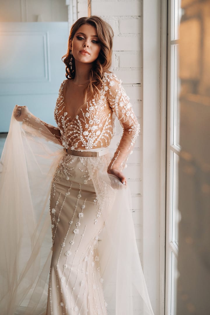 A luxurious bride in a wedding dress in the morning in her interior