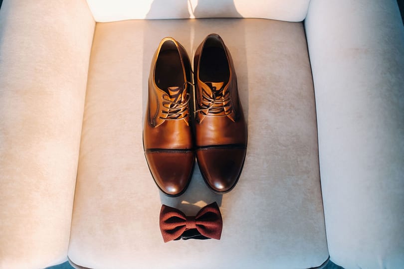 brown-bow-tie-on-a-light-background-and-boots-2023-11-27-05-36-40-utc