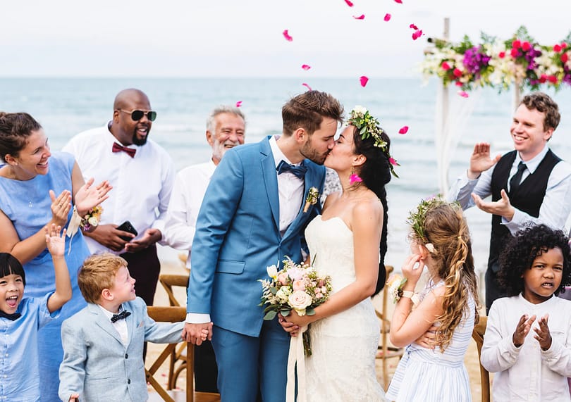 young-couple-kissing-at-wedding-reception-2026-01-07-23-27-38-utc